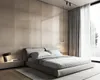 A modern bedroom with a large bed, tiled wall, and sheer curtains. Náhled obrázku produktu