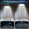 The image shows two installation methods for an industrial LED ceiling light: chain mounting and hook mounting. The background is a dimly lit industrial space with brick walls and corrugated metal. Produktbild-Vorschau