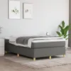 A bedroom scene with a bed, two framed pictures on the wall, and a plant. Náhled obrázku produktu