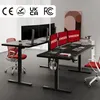 Two standing desks with multiple monitors in an office setting. Podgląd zdjęcia produktu
