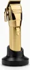 A gold BaBylissPRO GOLDFX CORDLESS CLIPPER is displayed on a black charging stand against a white background. Podgląd zdjęcia produktu
