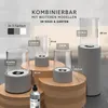 Several bioethanol table fireplaces of different sizes are displayed on wooden stands, with a bottle of bioethanol in the foreground. Produktbild-Vorschau