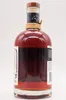 A close-up, studio shot of a bottle of rum against a white background. Produktbild-Vorschau