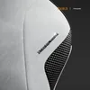 Close-up of a gaming chair's textured side panel and branding. Náhľad obrázku produktu