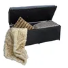 An open storage bench with cushions and a blanket inside, set against a white background. Produktbild-Vorschau