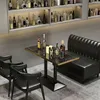 A bar or restaurant setting with a booth, table, and chairs, featuring bottles of alcohol on shelves and on the table. Anteprima dell’immagine prodotto