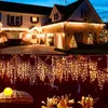 A collage of a house decorated with Christmas lights and a close-up of string lights. Produktbild-Vorschau