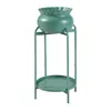 A green plant stand with a green pot on top, isolated on a white background. Náhľad obrázku produktu