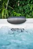 A close-up shot of a hot tub with bubbling water and a headrest. Náhled obrázku produktu