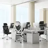 An office setting with multiple desks and ergonomic chairs. Produktbild-Vorschau