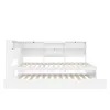 A white daybed with a pull-out trundle bed and a built-in headboard with shelves. Produktbild-Vorschau