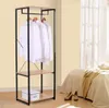 A clothing rack with white shirts, a box, and shelves in a room next to a bed. Náhľad obrázku produktu