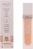 A product shot of a foundation bottle and its packaging. Podgląd zdjęcia produktu