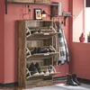 A rustic wooden shoe cabinet with multiple flip-down compartments and a coat rack with hanging coats. Náhled obrázku produktu