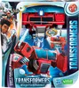 The image shows the packaging for a Transformers EarthSpark Spinchange Optimus Prime toy, featuring the toy itself, character art, and product information. Podgląd zdjęcia produktu