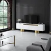 A modern living room with a white TV stand, a large window, and a coffee table. Náhľad obrázku produktu