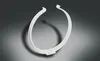 A white circular object with open ends is shown against a gradient gray background. Produktbild-Vorschau