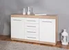 A white and wood-tone sideboard with drawers and doors, placed on a gray carpet in front of a gray wall. Decorative white vases and a white lantern are visible. Produktbild-Vorschau