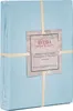 A folded light blue duvet cover is shown, wrapped with a paper band that has product information printed on it. Produktbild-Vorschau