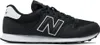 A side view of a black New Balance sneaker with a white sole and white 'N' logo. Voir les images du produit