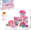 A dollhouse with accessories and dolls, shown with dimensions and packaging. Voir les images du produit