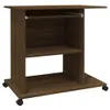 A brown wooden particleboard desk with wheels, shown from the front. Podgląd zdjęcia produktu