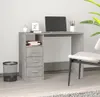 A desk with a laptop and office supplies in a room. Anteprima dell’immagine prodotto
