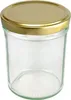 A clear studio shot of a glass jar with a gold lid. Podgląd zdjęcia produktu