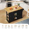 A black kitchen island with a wooden countertop is shown in a kitchen setting. The island has shelves and cabinets filled with various kitchen items. There are also icons at the bottom representing different kitchen uses. Voir les images du produit