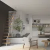 A modern living room with a staircase, furniture, and decor. Produktbild-Vorschau