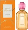 A perfume bottle and its packaging are displayed side-by-side against a white background. Voir les images du produit