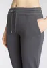 Close-up of a person wearing gray sweatpants. Produktbild-Vorschau