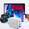 A collection of electronic devices and accessories, including a charger, camera, tablets, smartphones, and game controllers, arranged in a visually appealing composition. Produktbild-Vorschau