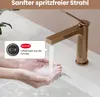 Hands washing under a rose gold faucet with a callout box explaining the aerator. Anteprima dell’immagine prodotto