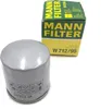 A silver oil filter and its green and yellow packaging are shown against a white background. Podgląd zdjęcia produktu