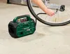 A person is using a portable air compressor to inflate a bicycle tire. Produktbild-Vorschau