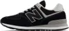 A side view of a black New Balance sneaker with gray and white accents, isolated on a white background. Voir les images du produit