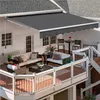 A spacious deck with outdoor furniture and a retractable awning. Produktbild-Vorschau