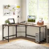 A home office setup with an L-shaped desk, computer, and accessories. Anteprima dell’immagine prodotto