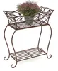 A brown metal plant stand with a potted plant on the top shelf. Anteprima dell’immagine prodotto