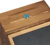 A close-up view of the top and side of a wooden box with a slot and a lock. Náhled obrázku produktu