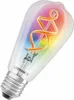 A close-up studio shot of a smart LED filament light bulb with a rainbow-colored glow. Produktbild-Vorschau