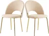 Two beige upholstered dining chairs with gold metal legs are shown against a white background. Podgląd zdjęcia produktu