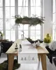 A dining table set for Christmas with festive decorations. Produktbild-Vorschau