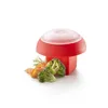 A red and white kitchen gadget shaped like a mushroom, with broccoli and some orange slices next to it. Podgląd zdjęcia produktu