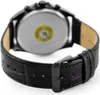 A close-up view of the back of a black leather watch strap and buckle, with the watch case visible in the background. Produktbild-Vorschau