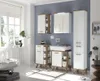 A modern bathroom with white and wood-toned furniture, including cabinets, a sink, and a tall storage unit. Náhled obrázku produktu