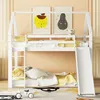 A white bunk bed with a slide and ladder, set up in a child's room with cartoon artwork on the wall. Produktbild-Vorschau