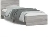 A single bed frame with a headboard, a mattress, and bedding. Voir les images du produit