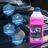 A bottle of pink coolant is placed in front of a car engine, with informational hexagons surrounding it. Produktbild-Vorschau